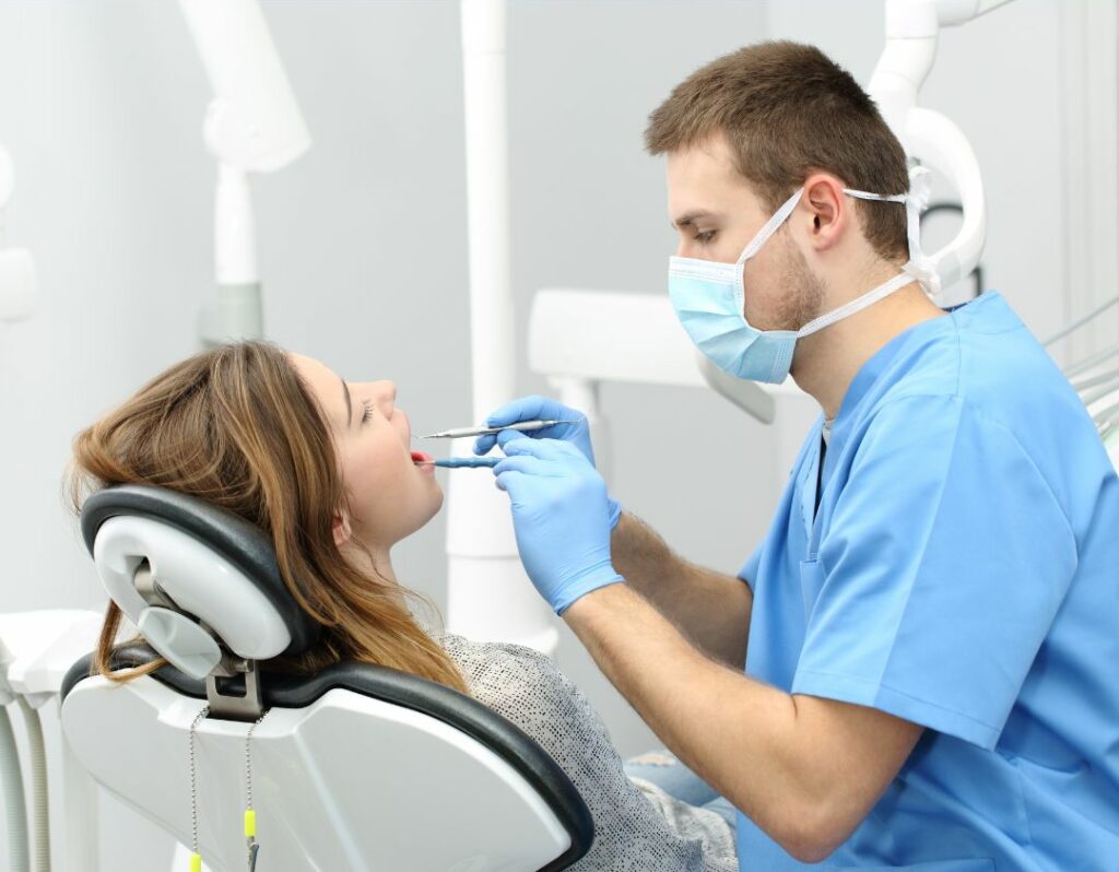 Young Dentist with Female Patient