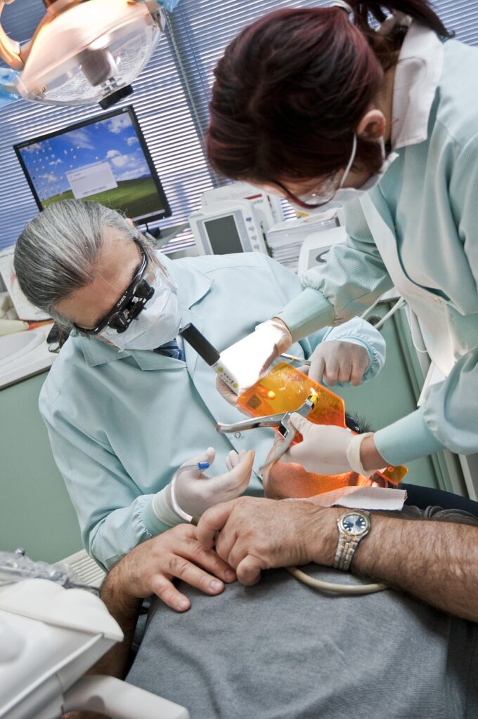 Man receiving a dental treatment.